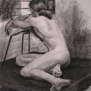 charcoal drawing of man seated on floor looking away while leaning on a chair