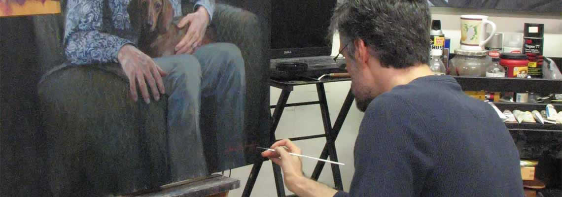 artist applies a signature to a commissioned portrait painting