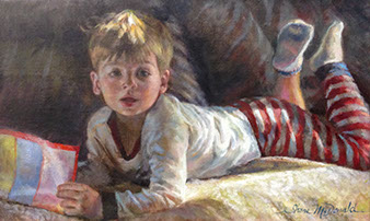 oil portrait of a young boy wearing pajamas laying on his stomach and reading on a couch