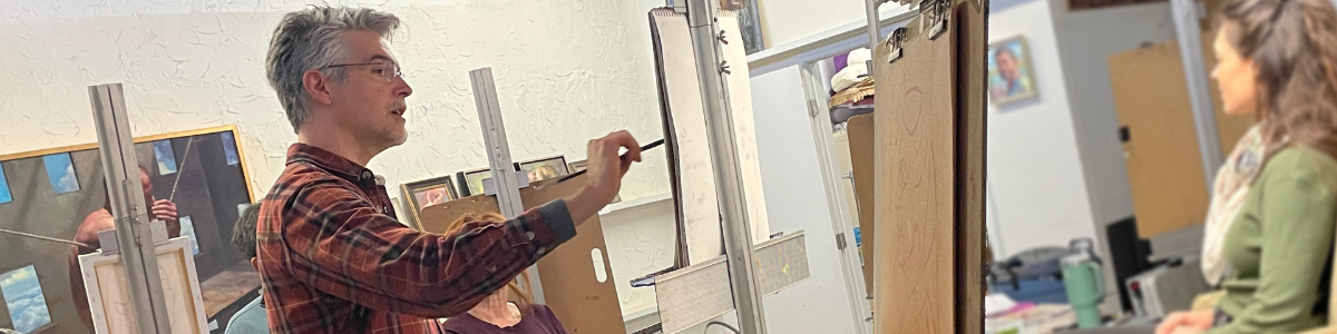 Shane teaches portrait painting to a workshop
