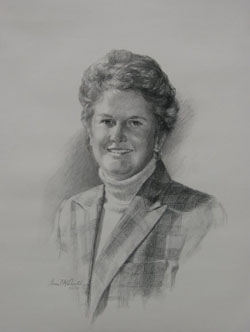 charcoal portrait drawing of a woman smiling and wearing business attire