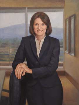 oil portrait painting of a smiling professional woman wearing a dark blazer and a white blouse