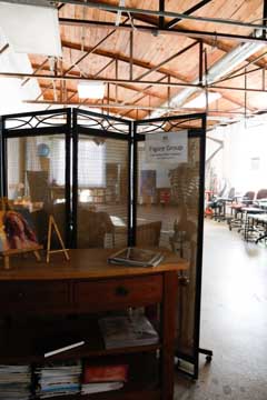 art studio screen separating instructional space for the figure group from storage